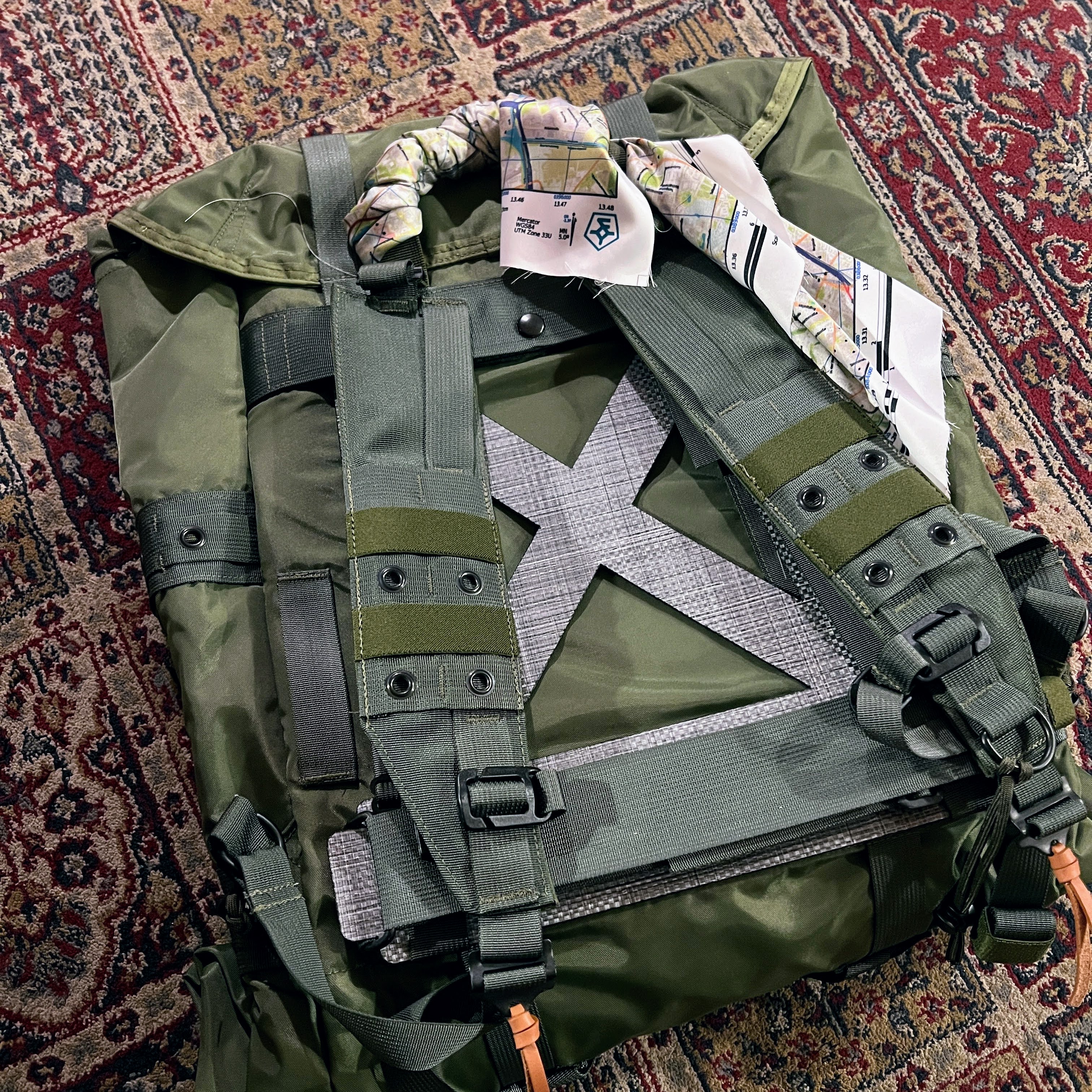 The Berlin escape map wrapped around the handle of the Corbet rucksack by the Observer Collection.