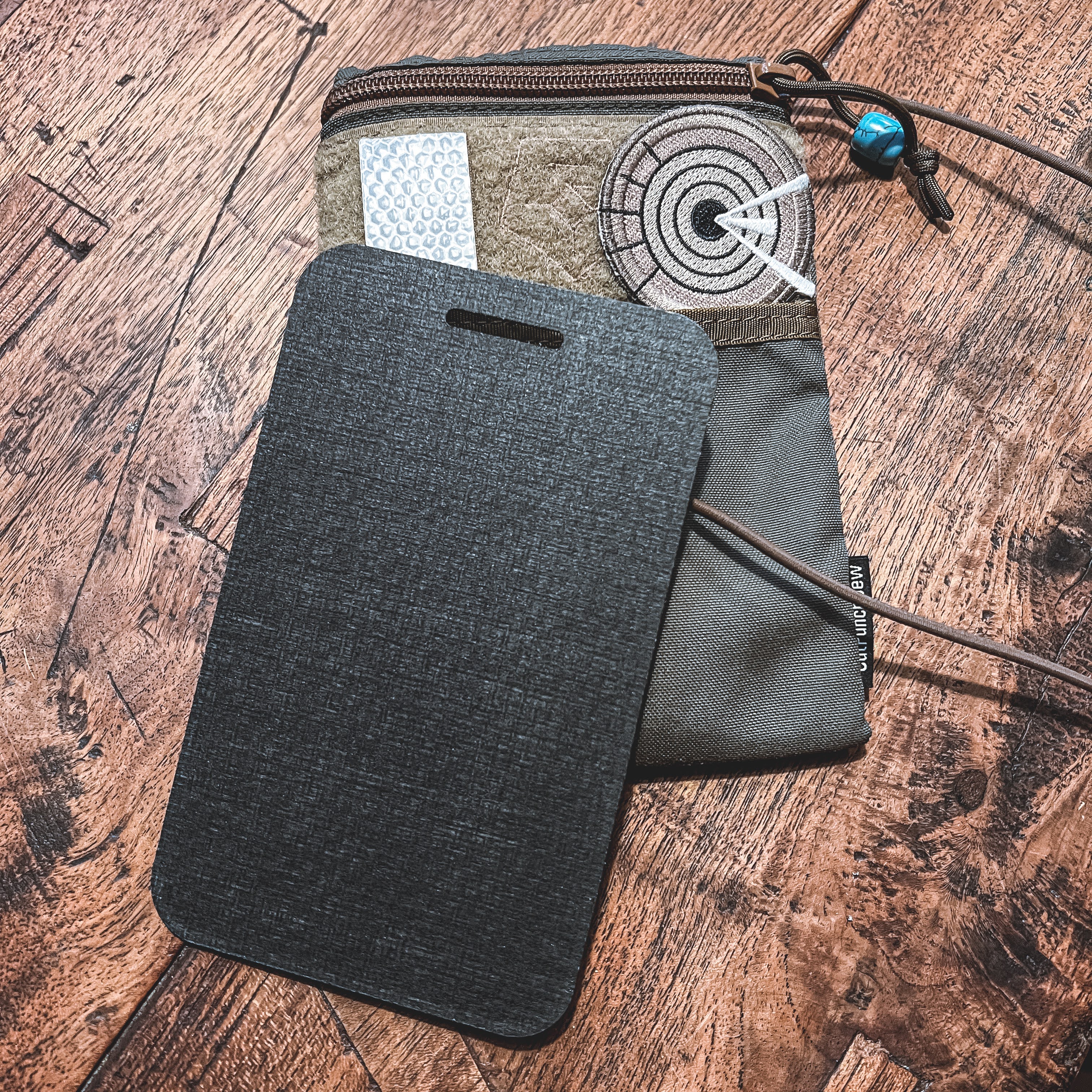 The Wndsn Passport Pouch and its optional internal divider.